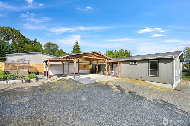 3664 N Red River Rd, Ferndale, WA 98248 - view of front of property featuring gravel driveway, an exterior structure, and an outdoor structure