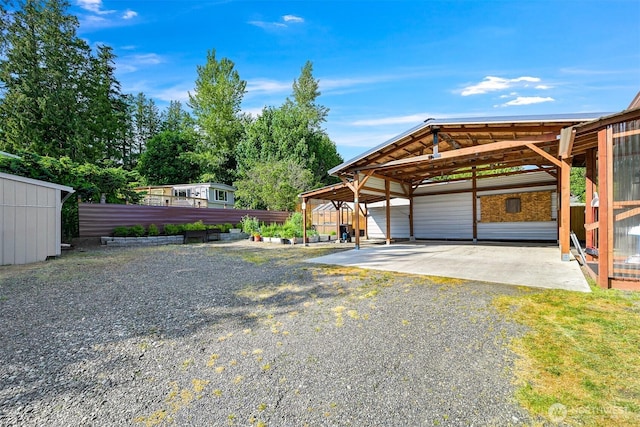 3664 N Red River Rd, Ferndale, WA 98248 - garage featuring gravel driveway and a carport