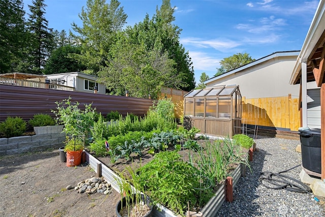 3664 N Red River Rd, Ferndale, WA 98248 - fenced backyard featuring a greenhouse, a vegetable garden, and an outdoor structure