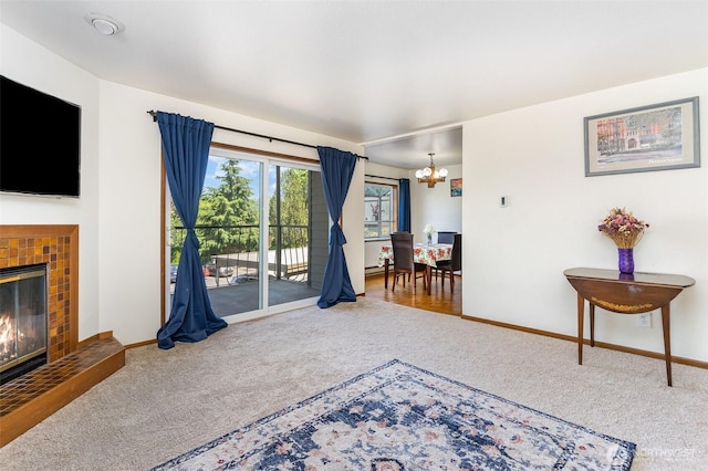 17440 NE 38th St Unit A201, Redmond, WA 98052 - living room featuring carpet floors, a chandelier, and a tile fireplace
