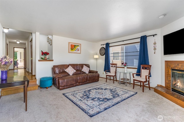 17440 NE 38th St Unit A201, Redmond, WA 98052 - carpeted living area featuring a tiled fireplace and baseboards