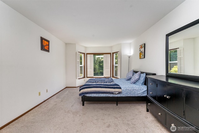 17440 NE 38th St Unit A201, Redmond, WA 98052 - bedroom featuring light colored carpet and baseboards