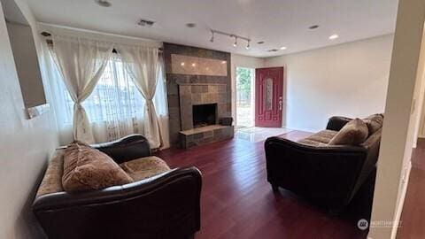 19604 108th Ave SE, Kent, WA 98055 - living room with wood finished floors, track lighting, and a fireplace