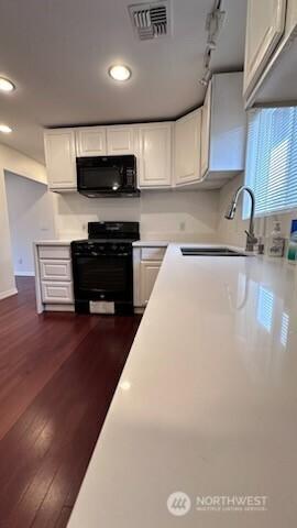 19604 108th Ave SE, Kent, WA 98055 - kitchen with black appliances, white cabinets, light countertops, dark wood finished floors, and recessed lighting