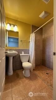 19604 108th Ave SE, Kent, WA 98055 - bathroom with tile patterned flooring and a tile shower