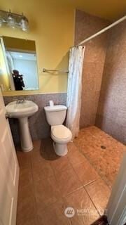 19604 108th Ave SE, Kent, WA 98055 - bathroom featuring a stall shower, tile patterned floors, and wainscoting