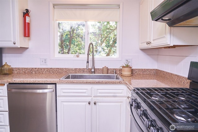 4708 63rd Ave W, Tacoma, WA 98466 - kitchen featuring stainless steel appliances, range hood, a sink, white cabinets, and tasteful backsplash