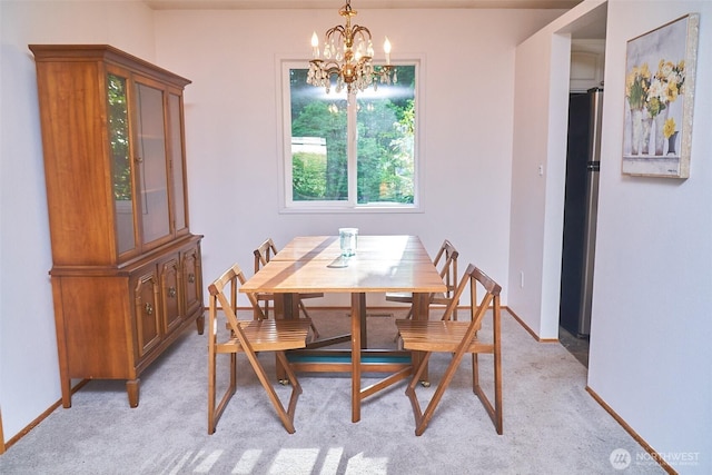 4708 63rd Ave W, Tacoma, WA 98466 - dining room featuring a chandelier, light colored carpet, and baseboards
