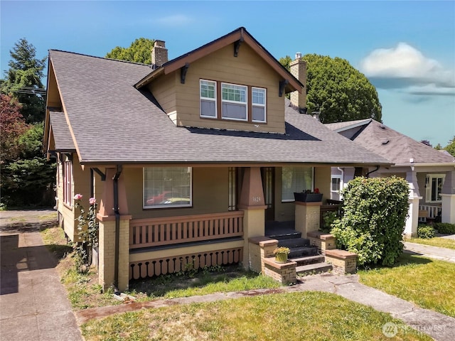 3824 S G St, Tacoma, WA 98418 - view of front of home featuring a chimney, covered porch, a shingled roof, and a front lawn
