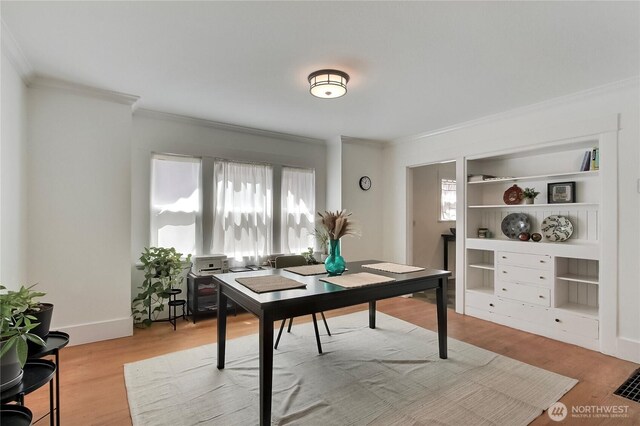 3824 S G St, Tacoma, WA 98418 - office area with ornamental molding, light wood finished floors, and built in shelves