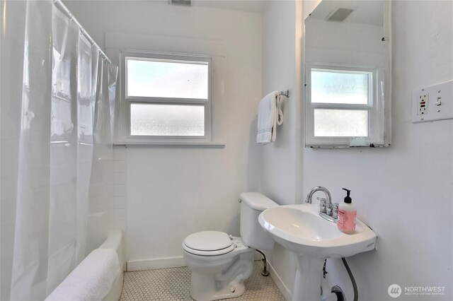 3824 S G St, Tacoma, WA 98418 - bathroom featuring healthy amount of natural light, shower / bath combo with shower curtain, and tile patterned floors