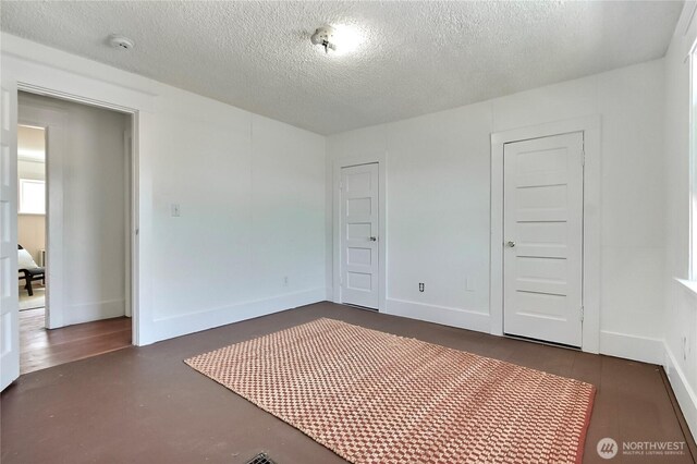 3824 S G St, Tacoma, WA 98418 - unfurnished bedroom featuring a textured ceiling