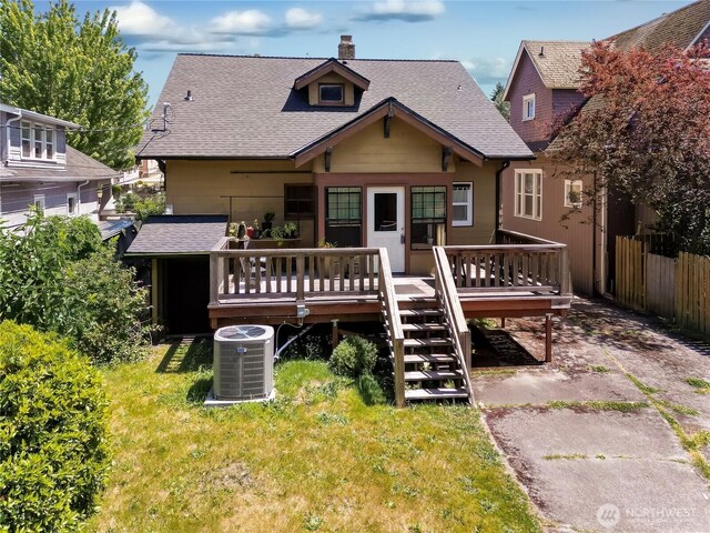 3824 S G St, Tacoma, WA 98418 - back of property with a chimney, a deck, and roof with shingles