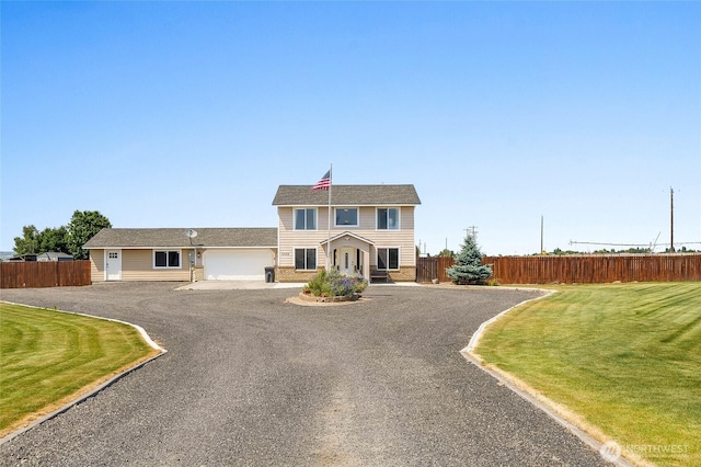 2352 W Covey Dr, Othello, WA 99344 - view of front of property featuring gravel driveway, brick siding, and an attached garage
