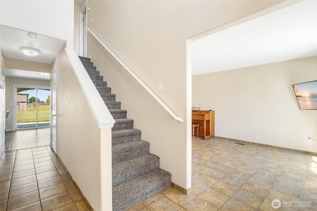 2352 W Covey Dr, Othello, WA 99344 - stairs featuring baseboards and stone finish floors