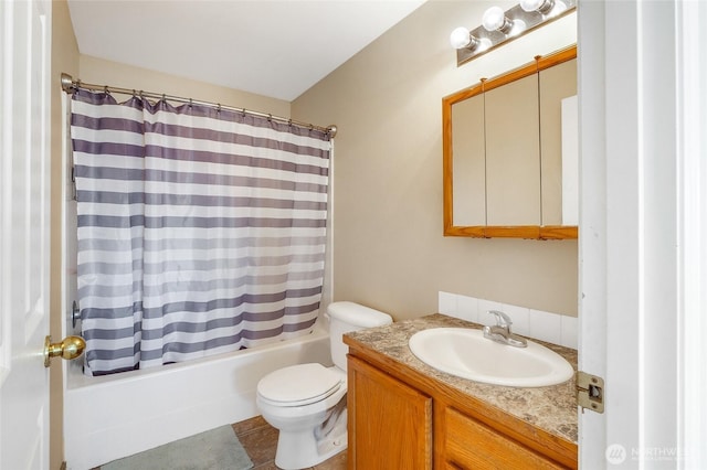 2352 W Covey Dr, Othello, WA 99344 - bathroom with vanity, toilet, and shower / bath combo with shower curtain