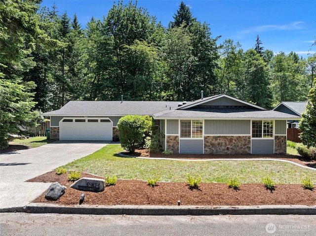 3903 Westpark Ct NW, Olympia, WA 98502 - view of front of property with stone siding, a garage, concrete driveway, and a shingled roof