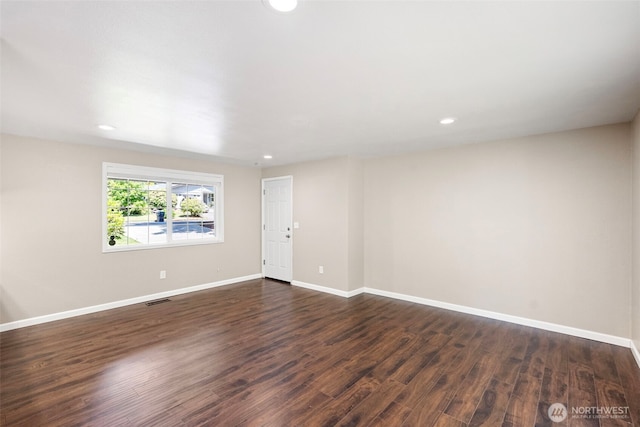 3903 Westpark Ct NW, Olympia, WA 98502 - spare room with dark wood-style flooring and recessed lighting
