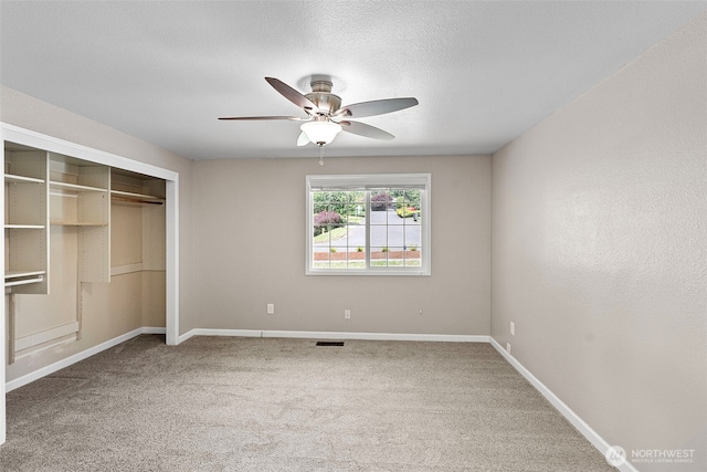3903 Westpark Ct NW, Olympia, WA 98502 - unfurnished bedroom featuring carpet flooring, a closet, and a ceiling fan