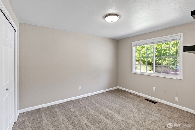 3903 Westpark Ct NW, Olympia, WA 98502 - unfurnished bedroom featuring a closet and carpet