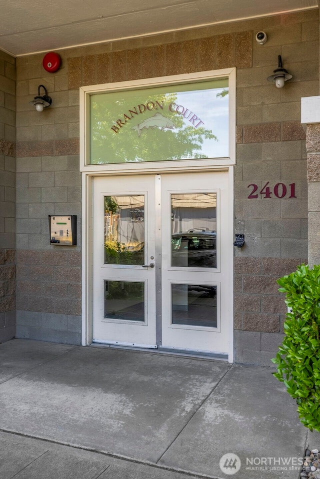 2401 SW Brandon St Unit 210, Seattle, WA 98106 - property entrance with concrete block siding