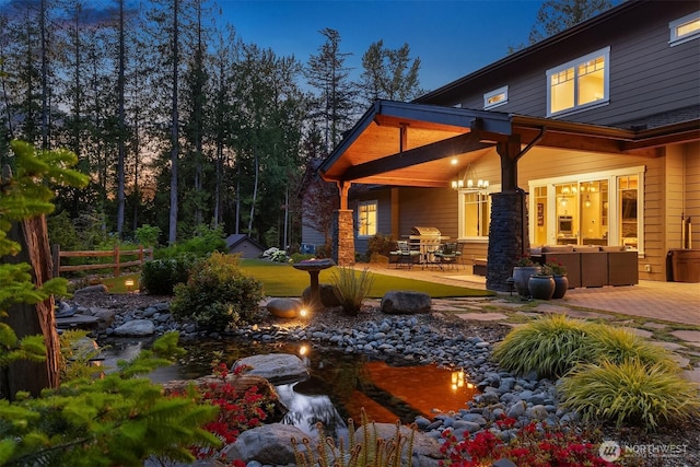 26507 SE Old Black Nugget Rd, Issaquah, WA 98029 - view of yard featuring a small pond and a patio area