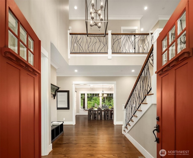 26507 SE Old Black Nugget Rd, Issaquah, WA 98029 - entrance foyer featuring a chandelier, a towering ceiling, dark wood-style flooring, stairs, and ornamental molding