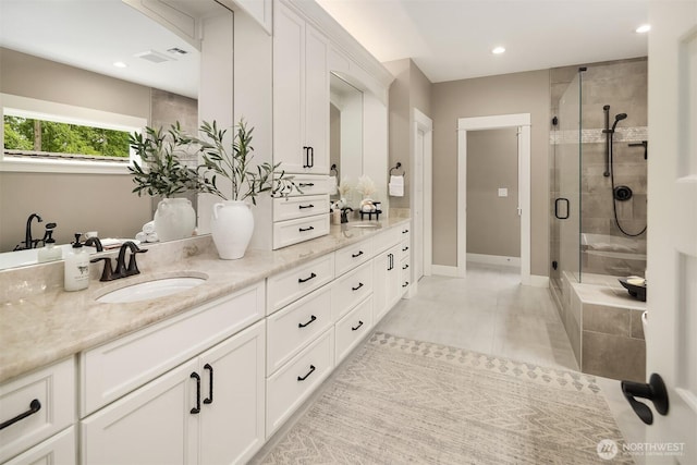 26507 SE Old Black Nugget Rd, Issaquah, WA 98029 - bathroom with double vanity, a shower stall, recessed lighting, and tile patterned flooring