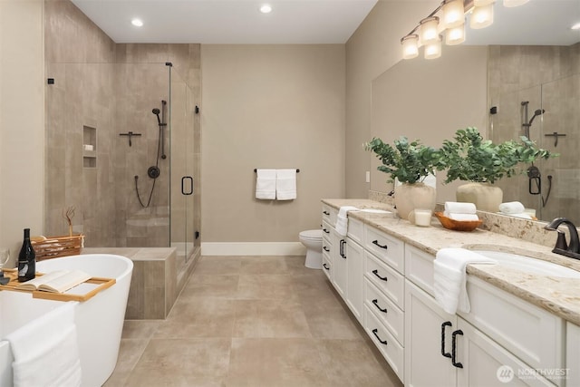26507 SE Old Black Nugget Rd, Issaquah, WA 98029 - full bath featuring double vanity, a freestanding bath, a shower stall, recessed lighting, and tile patterned floors