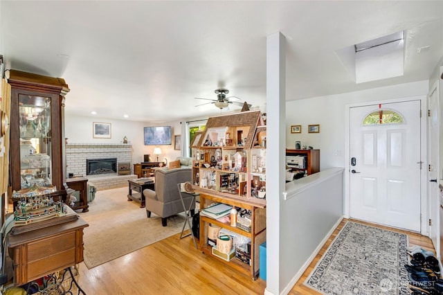 10825 4th Ave W, Everett, WA 98204 - entryway featuring light wood-style floors, a fireplace, and ceiling fan