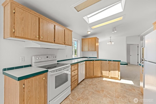 140 Big Sky Ln, Sequim, WA 98382 - kitchen with white appliances, under cabinet range hood, a skylight, a peninsula, and a chandelier