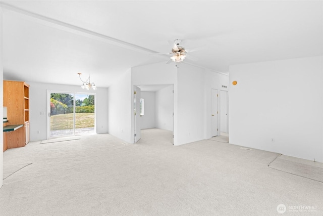 140 Big Sky Ln, Sequim, WA 98382 - unfurnished living room featuring light colored carpet, a chandelier, ceiling fan, and lofted ceiling