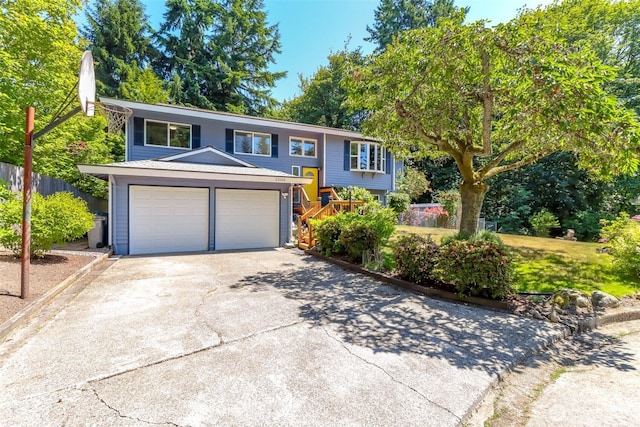 23310 133rd Ct SE, Kent, WA 98042 - bi-level home featuring concrete driveway and a garage