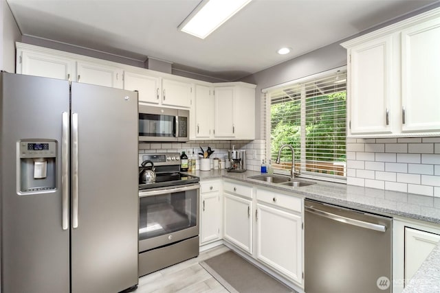 23310 133rd Ct SE, Kent, WA 98042 - kitchen with stainless steel appliances, white cabinets, tasteful backsplash, light stone countertops, and recessed lighting