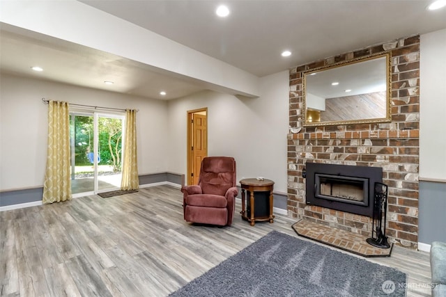 23310 133rd Ct SE, Kent, WA 98042 - sitting room featuring wood finished floors, recessed lighting, and a brick fireplace