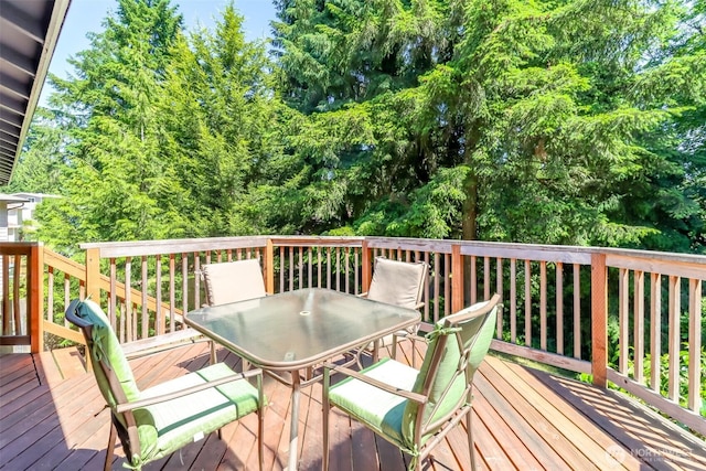 23310 133rd Ct SE, Kent, WA 98042 - wooden deck featuring outdoor dining space and view of wooded area
