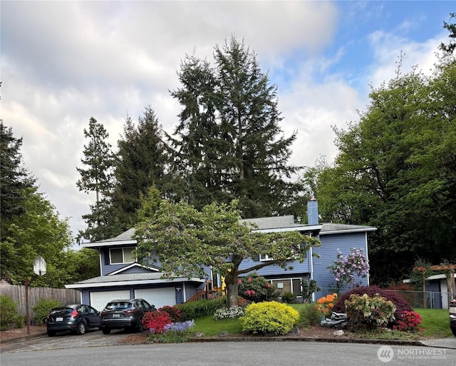 23310 133rd Ct SE, Kent, WA 98042 - obstructed view of property featuring a garage and a chimney