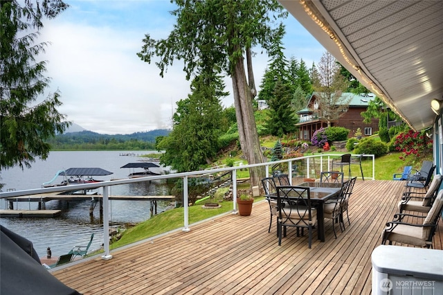 18933 W Big Lake Blvd, Mount Vernon, WA 98274 - wooden deck featuring a water view, boat lift, a dock, and outdoor dining space
