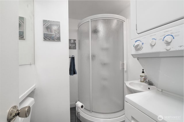 18933 W Big Lake Blvd, Mount Vernon, WA 98274 - bathroom featuring stacked washer / drying machine and a shower stall