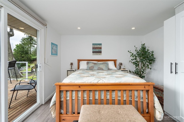 18933 W Big Lake Blvd, Mount Vernon, WA 98274 - bedroom featuring access to exterior, wood finished floors, and recessed lighting