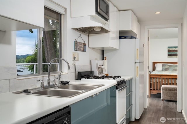 18933 W Big Lake Blvd, Mount Vernon, WA 98274 - kitchen featuring gas range oven, white cabinetry, light countertops, black dishwasher, and custom exhaust hood