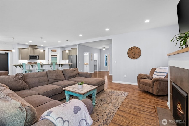5609 Stetson Ct NW, Olympia, WA 98502 - living room with a tile fireplace, wood finished floors, and recessed lighting