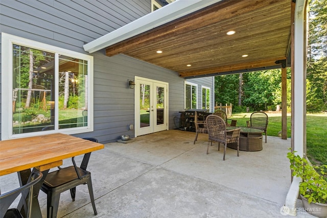 5609 Stetson Ct NW, Olympia, WA 98502 - view of patio featuring french doors and outdoor dining space