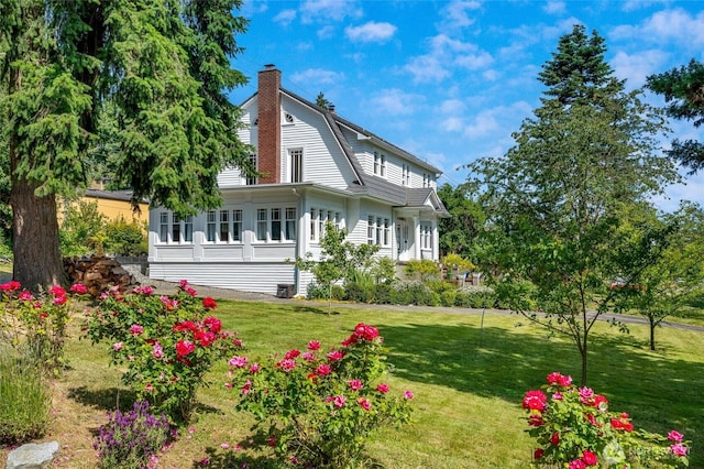 4918 S 3rd Ave, Everett, WA 98203 - back of property featuring a chimney, a lawn, and a gambrel roof