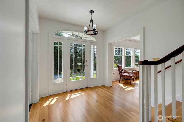 4918 S 3rd Ave, Everett, WA 98203 - entrance foyer featuring stairway, light wood-style flooring, and a chandelier