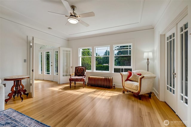 4918 S 3rd Ave, Everett, WA 98203 - living area with radiator, french doors, light wood-type flooring, and ceiling fan