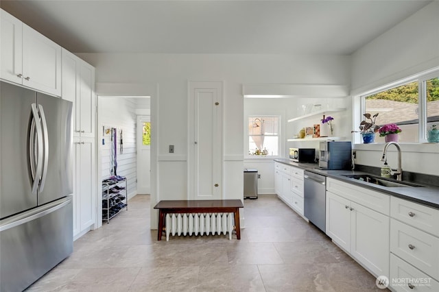 4918 S 3rd Ave, Everett, WA 98203 - kitchen featuring appliances with stainless steel finishes, dark countertops, white cabinetry, and open shelves