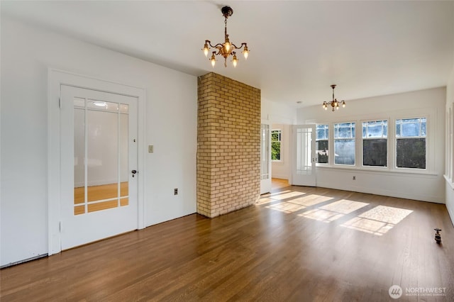 4918 S 3rd Ave, Everett, WA 98203 - unfurnished living room featuring a chandelier and wood finished floors