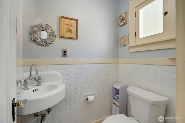 4918 S 3rd Ave, Everett, WA 98203 - bathroom featuring wainscoting and tile walls