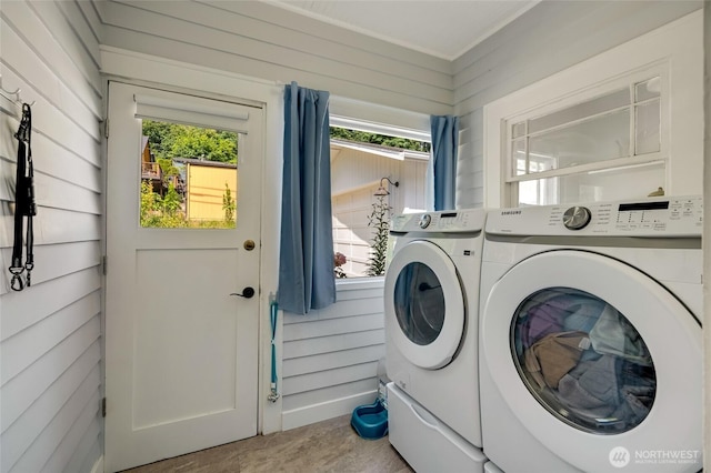 4918 S 3rd Ave, Everett, WA 98203 - laundry room with washer and dryer, plenty of natural light, and wooden walls
